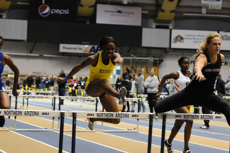 UP AND OVER: Waterville Senior High School graduate Ci’ara Williams runs the hurdle events at Northern Arizona University.