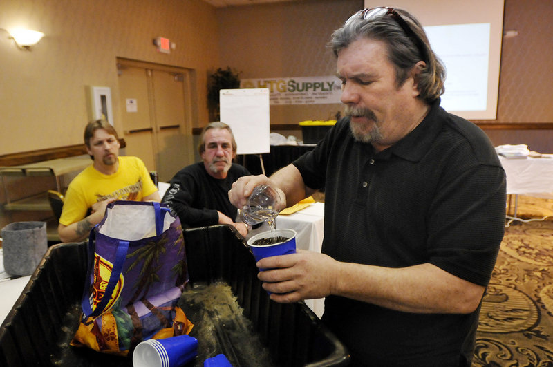 Instructor Ray Logan, top, uses a Cayenne Pepper for demonstrations. Left, he show the germination process during a class Saturday, Students are Bill Lessard of Saco, left and Rick Adjutant of Kennebunk. Logan uses tobacco, peppers and basil in a growing hut (background) for demonstrations.