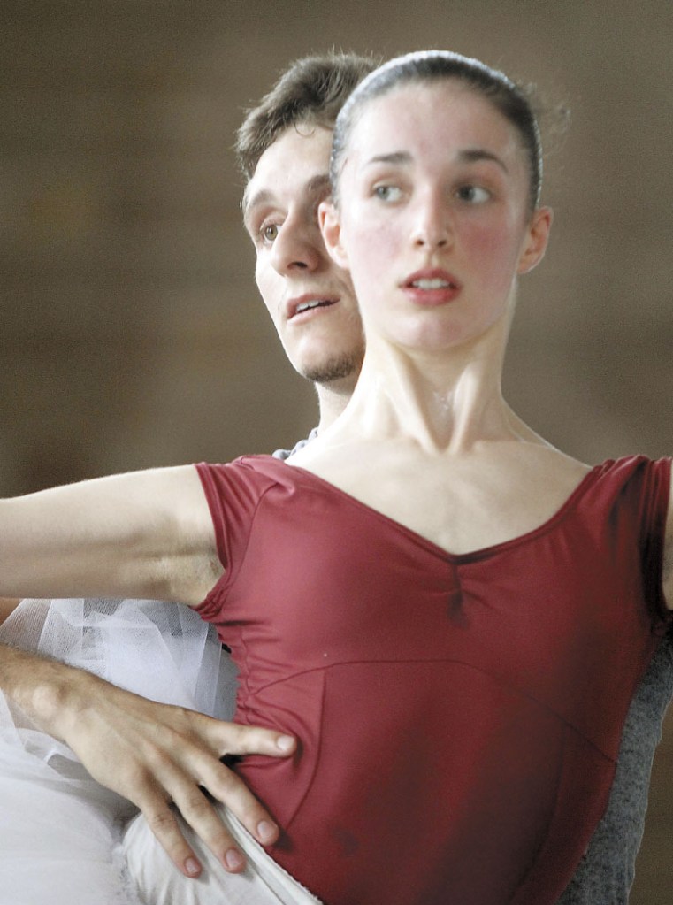 Ryan Jolicoeur-Nye listens to instructions from Andrei Bossov while rehearsing with Caroline Doherty for the Bossov Ballet Theatre's production of "Swan Lake" in Pittsfield recently.