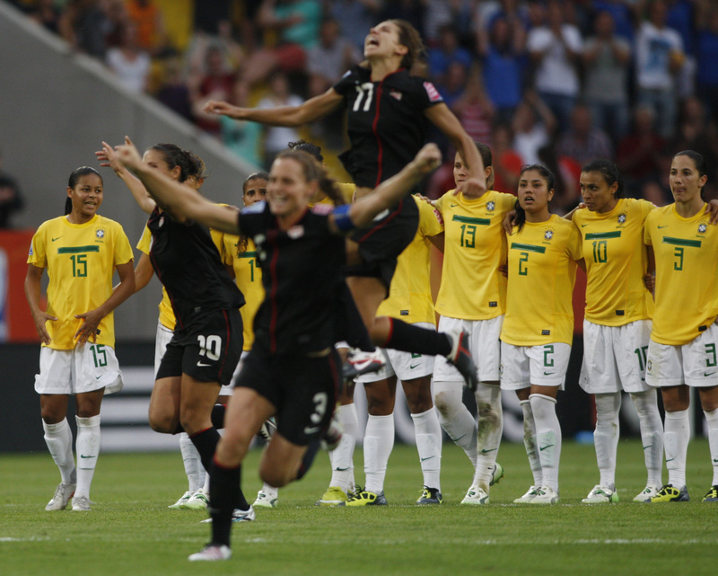 US players celebrate after beating Brazil in a penalty shootout in the quarterfinals at the Women's Soccer World Cup in Dresden, Germany, today.