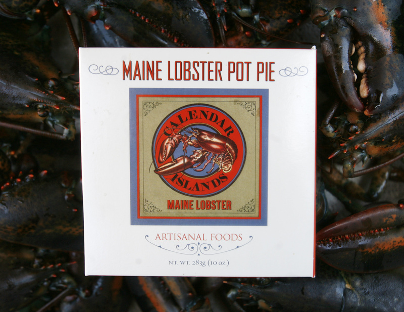 A frozen lobster pot pie package is posed by a bunch of live lobsters near the wharf in Portland, Maine. A varied selection of prepared frozen products, such as lobster macaroni and cheese, lobster pot pie and lobster pizza, are making their way to grocery store freezers.