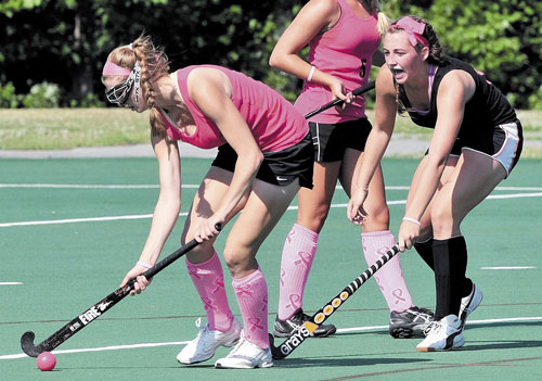 GET BACK HERE: Skowhegan’s Charlotte Johnstone, left, is pressured by Nokomis’ Marissa Shaw during the Drive Out Cancer Challenge on Friday at Colby College in Waterville.
