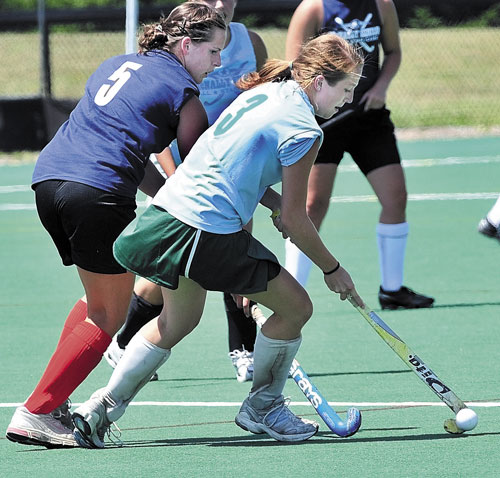MOVING DOWN THE FIELD: West All Star player Sabrina Link, left, and East player Nikki Scott face off during the McNally Senior All- Star Game on Saturday at Colby College.