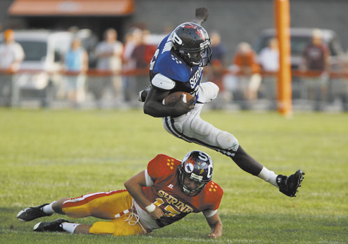 TAKEDOWN: East Squad’s Kyle Bishop of Waterville Senior High School takes down West Squad’s Imadhi Zagon of Portland High School during the 22nd annual Lobster Bowl on Saturday in Biddeford. The game brings together top players from across the state to raise money for the Shriners Children Hospitals and Shriners Burns Institutes.