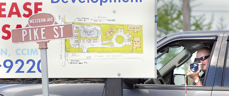 Sgt. Christopher Shaw points a laser gun to clock the speed of oncoming during a speeding enforcement detail Friday morning on Western Avenue in Augusta. When Shaw spotted a speeder he dispatched one of four officers after the car.