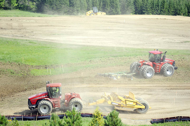 Earth moving equipment breaks the ground for the new regional MaineGeneral Hospital in Augusta. The hospital received financing Thursday to build the new facility.