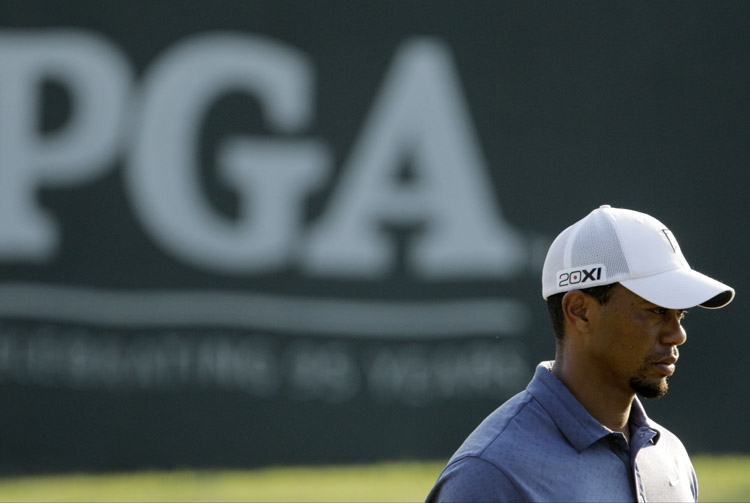 Tiger Woods waits to finish on the 18th green during the second round of the PGA Championship golf tournament on Friday at the Atlanta Athletic Club in Johns Creek, Ga.