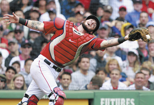 NICE CATCH: Boston catcher Jarrod Saltalamacchia makes the catch on a pop foul by Tampa Bay’s Kelly Shoppach in the seventh inning of the first game of a doubleheader Tuesday in Boston.