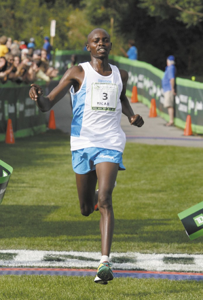 OVERALL WINNER: Micah Kogo is the first runner to cross the finish line at the14th annual Beach to Beacon 10K Road Race on Saturday in Cape Elizabeth.