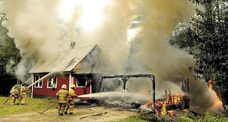 TO NO AVAIL: Dozens of firefighters from Lakes Region Mutual Aid — which includes Mount Vernon, Fayette, Manchester, Readfield, Vienna and Wayne as well as firefighters from Belgrade — spent about 90 minutes trying to get a house fire under control Tuesday on Wings Mills Road in Mount Vernon. Nobody was injured in the fire, which was sparked by lightning during a storm that swept through the area around noon. Mount Vernon Deputy Fire Chief Tony Dunn said the home is a complete loss.