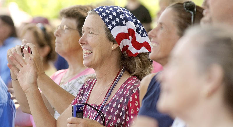 Denise Hylton is decked out in a red, white and blue outfit to watch the parade to celebrate the Town Of Washington's bicentennial on Saturday.