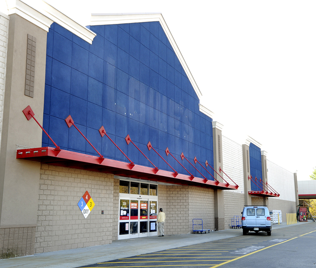 A customer arrives to find the Lowe's sign removed and a "closed" notice on the front door of Lowe's former store in Biddeford.