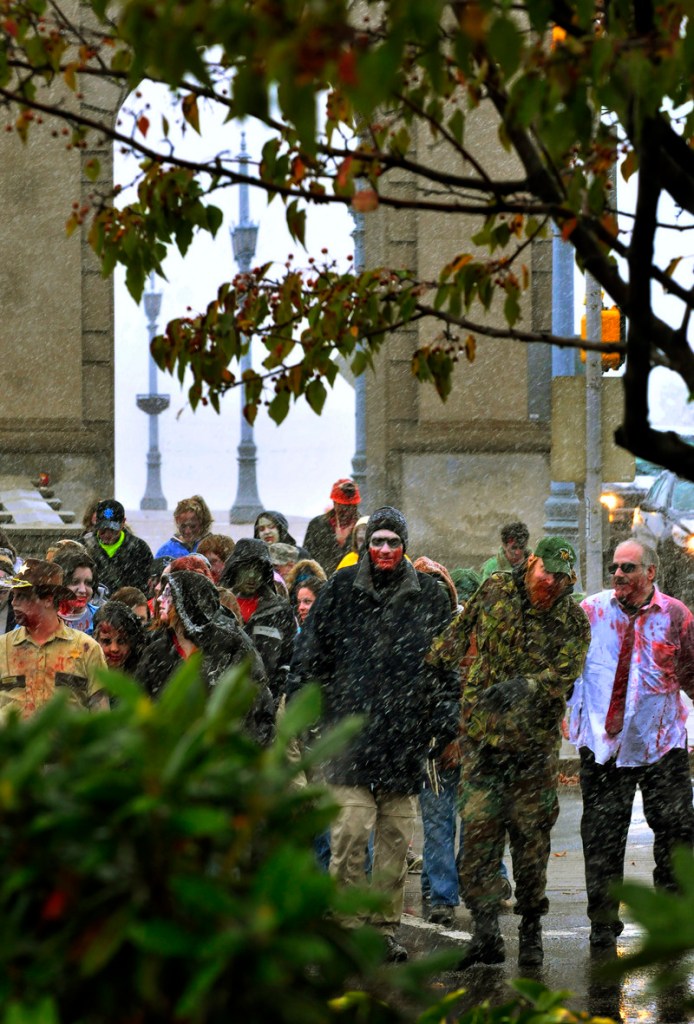 A large group of people dressed as Zombies participated in the 2nd annual zombie walk from Kirby Park to Wilkes-Barres Public Square and back in the snow on Saturday. 10/25/20111 Aimee Dilger/The Times Leader