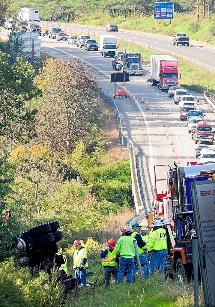 LONG COMMUTE: Northbound traffic backs up as vehicles move into one lane to go around a tanker truck crash Friday on Interstate 95 between the Bond Brook overpass and exit 112 in Augusta. Traffic was backed up for as much as 8 miles Friday afternoon, nearly 13 hours after the crash.