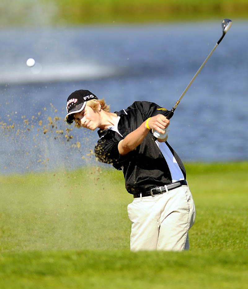 Maranacook Community High School's Bailey Clark putts Monday during the state golf tournament in Vassalboro.