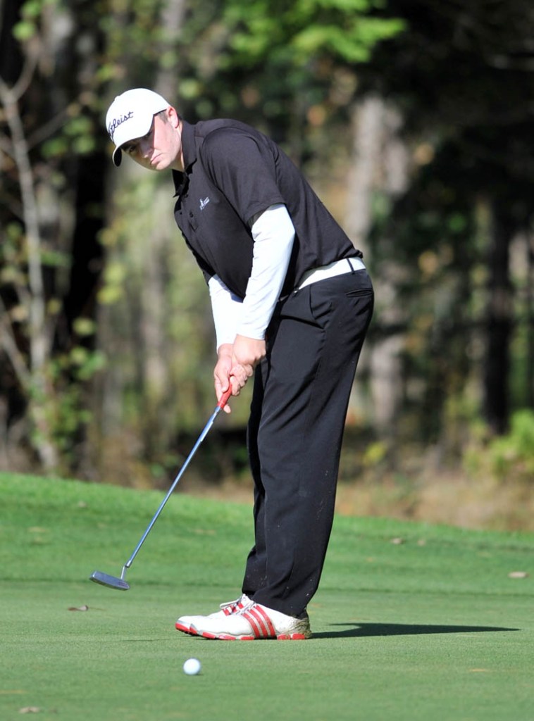 Seth Sweet of Madison High School watches his putt on the 14th green Saturday on the Tomahawk course at Natanis Golf Course in Vassalboro.