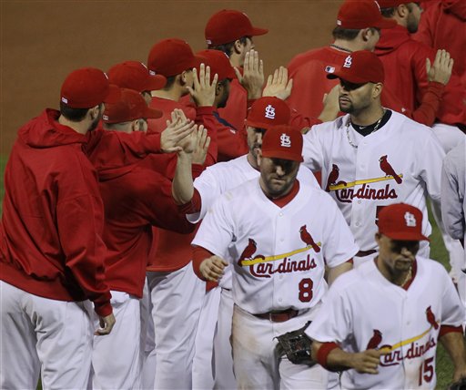 The St. Louis Cardinals celebrate after beating the Milwaukee Brewers in Game 3 of the NLCS on Wednesday in St. Louis.