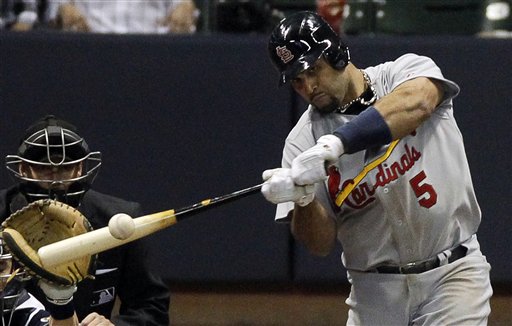 St. Louis Cardinals' first baseman Albert Pujols hits an RBI double in the fifth inning of Game 2 of the NLCS against the Milwaukee Brewers Monday in Milwaukee.