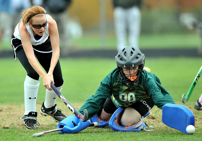 Staff photo by Michael G. Seamans Skowhegan Area High School's Renee Wright, 2, tries to get a shot past Brunswick High School goalie Sydney Escoe, 00, in the second half in an Eastern A regional quarterfinal at Skowhegan Area High School Wednesday afternoon. Skowhegan defeated Brunswick 6-0.