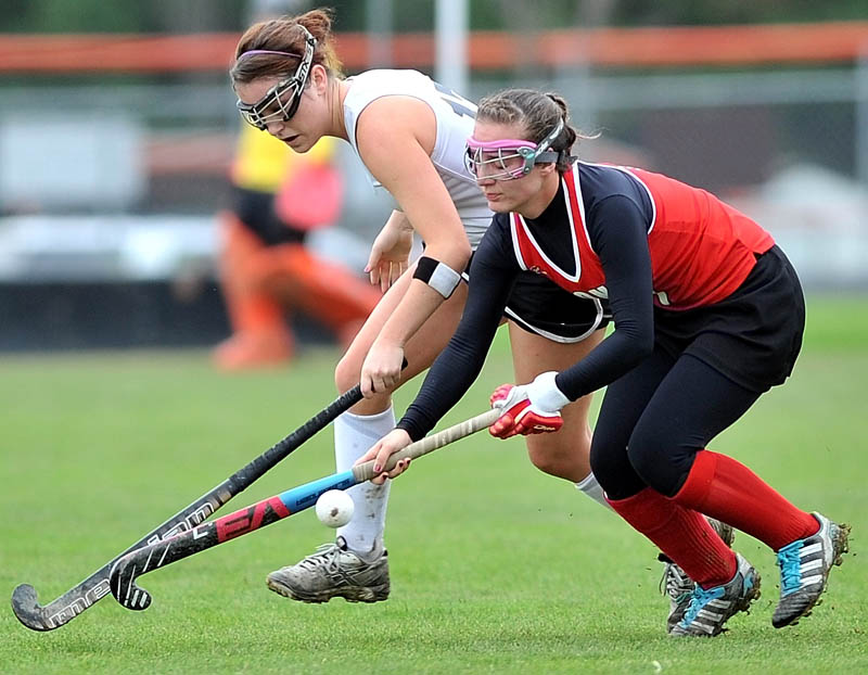 Skowhegan Area High School's Jessica Skillings, 17, back, battles for the ball with Cony High School's Kaitlyn Labby, 7, in the Eastern A semifinals in Skowhegan Saturday morning. Skowhegan defeated Cony 5-2.