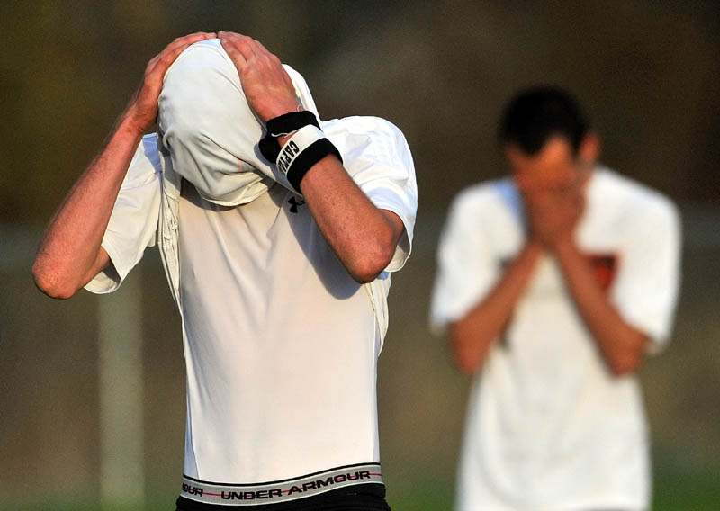 Staff photo by Michael G. Seamans MacKenzie Michaud, 21, left, reacts after losing to Mt. View High School 3-0 in an Eastern B quarterfinal game at Kennebec Savings Bank Field in Winslow.