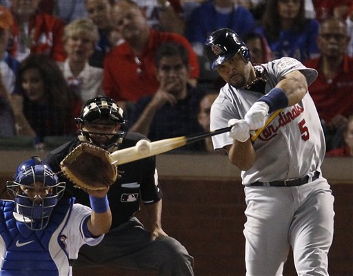 St. Louis Cardinals' Albert Pujols hits a three-run home run during the sixth inning of Game 3 of baseball's World Series against the Texas Rangers on Saturday in Arlington, Texas.