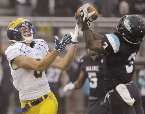 TAKEAWAY: Maine’s Trevor Coston (3) intercepts a pass intended for Delaware’s Mark Schenauer in the first quarter Saturday in Orono.