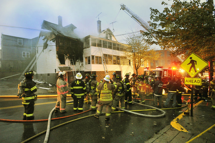 The scene of the fatal fire in an apartment house in Biddeford. Firefighters from Biddeford, Saco and Arundel were on the scene to fight the fire that left one man dead.