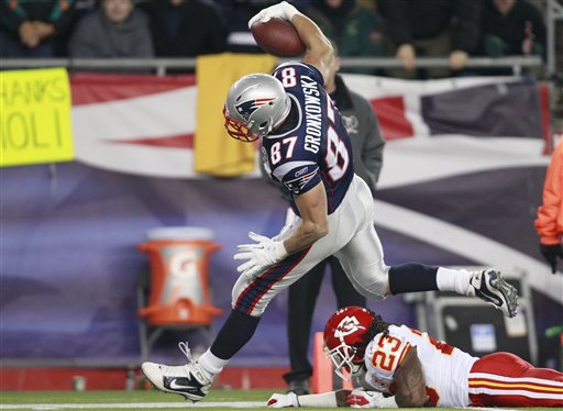 New England Patriots tight end Rob Gronkowski (87) stays inbounds as he scores a touchdown leaving Kansas City Chiefs free safety Kendrick Lewis (23) on the turf Monday in Foxborough, Mass.