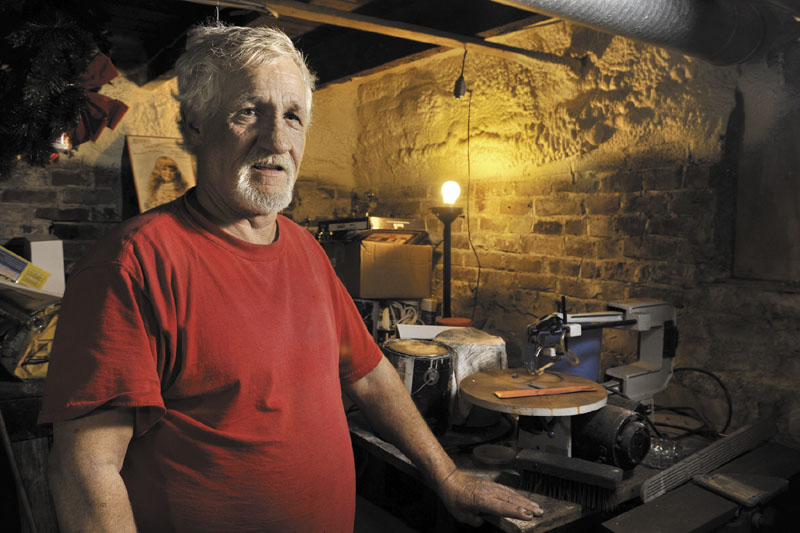 Mark Mowatt, of Portland, has cut his oil use in half with a big weatherization effort on his Bradley Street home. Mowatt had foam insulation blown in along the sill of his basement.