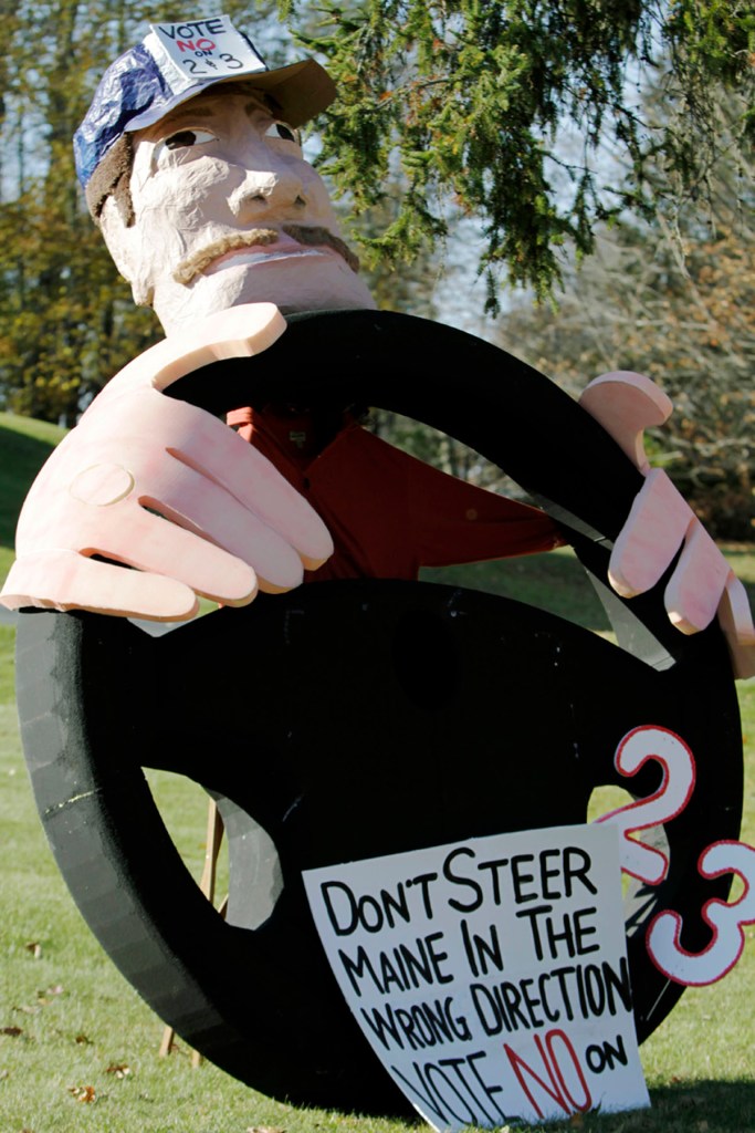 A large lawn ornament regarding elections is displayed in Biddeford on Tuesday. For the eighth time in 11 years, Maine voters were asked to consider ballot questions on gambling.