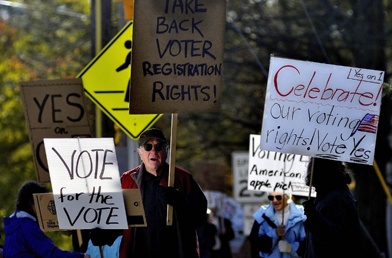 RAISING THEIR VOICE: Jack Roth, of Wilton, leads the “Yes on 1” rally down Main Street in Farmington on Saturday.