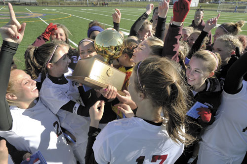 BACK-TO-BACK: The Richmond girls celebrate their 4-1 win over Van Buren in the Class D girls soccer state championship game Saturday in Yarmouth.