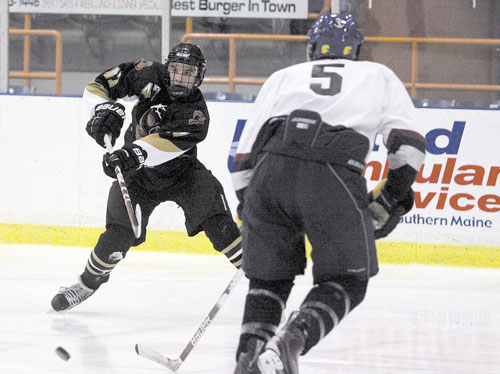 LOOKING FOR AN OPENING: Waterville native Chris Lee moves the puck past a Casco Bay defender during a semifinal game of the U-18 state tournament at the Androscoggin Bank Colisee in Lewiston earlier this month. Lee and the Moose prevailed 5-3 and advanced to the championship game, where they blanked Lewiston 3-0. The Moose will next compete in the national tournament March 28 in Lansing, Mich.