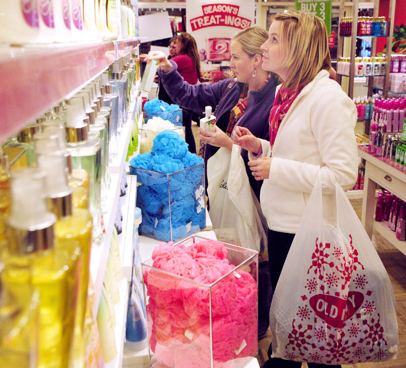 Amy Monahan, left, and Amanda Judkins, both of Lisbon,shop at Bath & Body Works at 5:10 a.m. Friday in Marketplace At Augusta. They and two other women said they'd left Bangor at 10 p.m. Thursday to start shopping at midnight in Augusta.