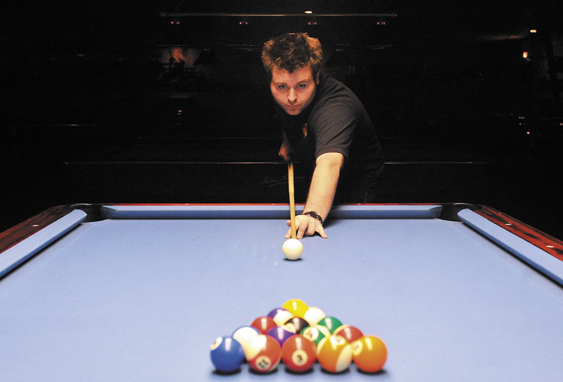 READY TO GO: Pro billiards player Mike Dechaine poses for a portrait Wednesday at TJ’s Classic Billiards in Waterville. Dechaine will play for Team USA in the Mosconi Cup tournament next month.