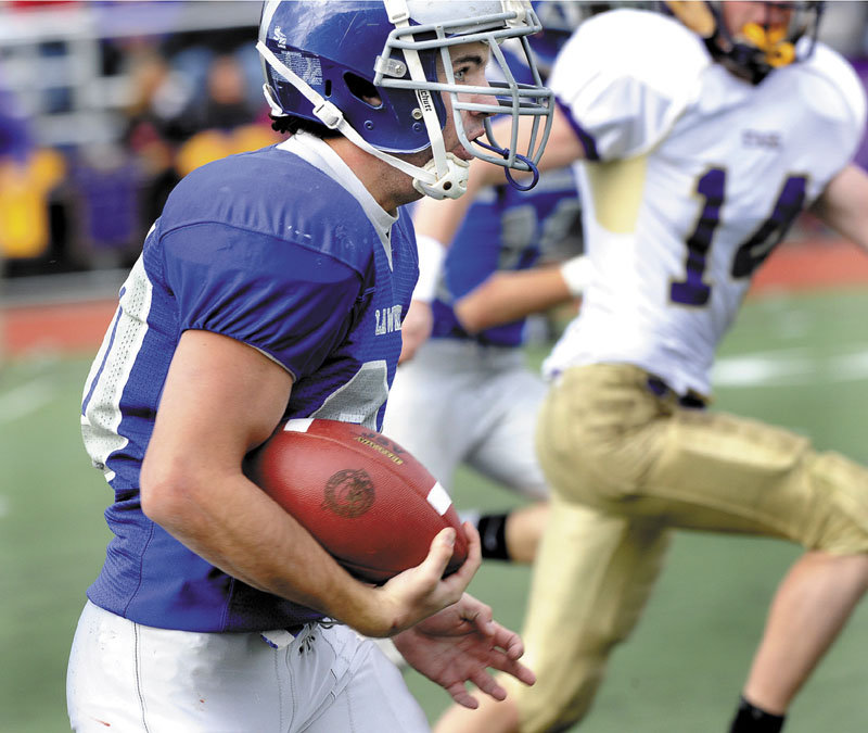 TOUCHDOWN RUN: Lawrence’s Anthony Sementelli runs for the team’s only touchdown Saturday in the Class A state championship game against Cheverus at Fitzpatrick Stadium in Portland. Cheverus won 49-7.