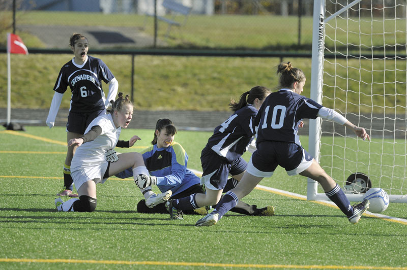 Richmond's Taylor Clapp, watches her shot cross the goal line for her team's first goal.