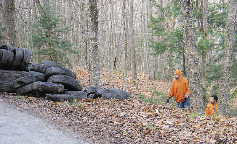 LOOKING FOR CLUES: Bruce Inch, chairman of the Mount Vernon Board of Selectmen, is hoping that someone saw either the 200 tires being illegally dumped or a truck making numerous trips to the area. Inch said the tire pile “was quite an impressive mess.”