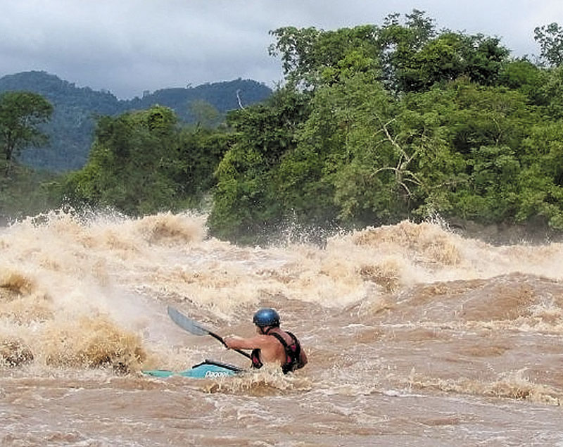 Mick O'Shea paddles a stretch of the Mekong RIver in Laos in China during a 2004 voyage down the river's 2,800-mile length. The trip is the subject of two Waterville events this week: a Tuesday screening of the film "Mekong: Exploring the Mother of Waters" and a Wednesday slideshow presentation and discussion.