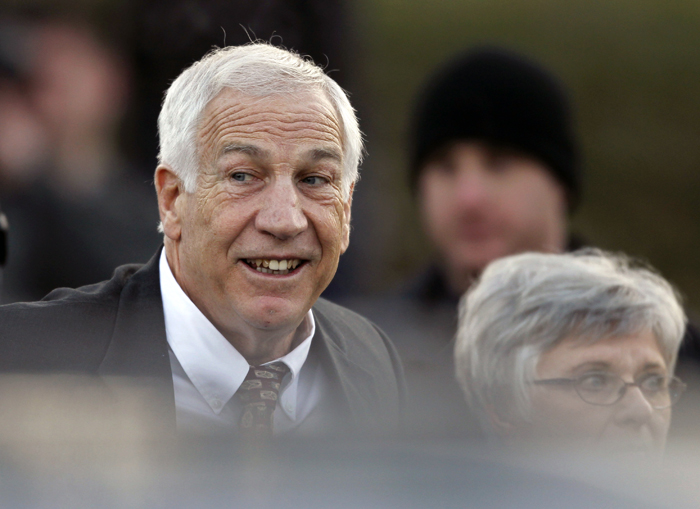 Jerry Sandusky, the former Penn State assistant football coach charged with sexually abusing boys, arrives with his wife, Dottie Sandusky, at the Centre County Courthouse for a preliminary hearing today in Bellefonte Pa.