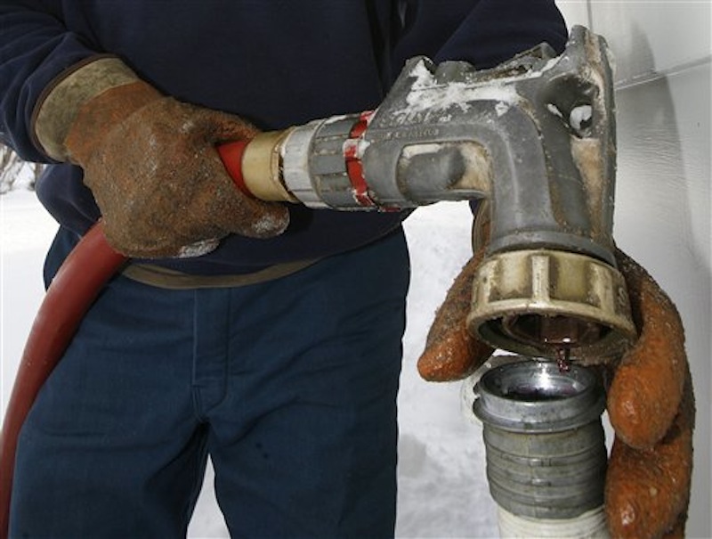 In this Jan. 2, 2008 file photo, heating oil is delivered to a home in Barre, Vt. Thousands of poor people across the Northeast are bracing for a difficult 2011 winter with substantially less home heating aid coming from the federal government. (AP Photo/Toby Talbot, File)