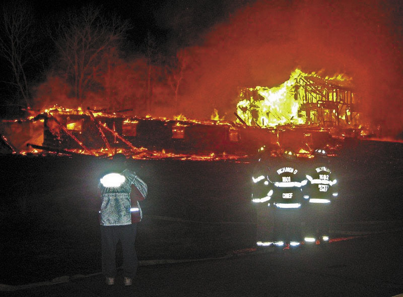 UP IN FLAMES: An unoccupied house and attached barn on Plains Road in Litchfield is engulfed by fire early Friday morning. A horse kept at the barn was in a pasture and was not injured, firefighters said.