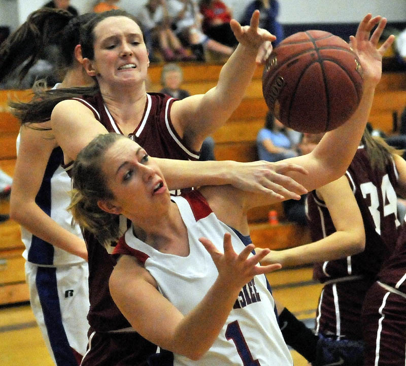 Messalonskee High School's Shelby Cutten, front, battles for the loose ball with Bangor High School's Katie Brochu during the first quarter Tuesday night at Messalonskee High School.