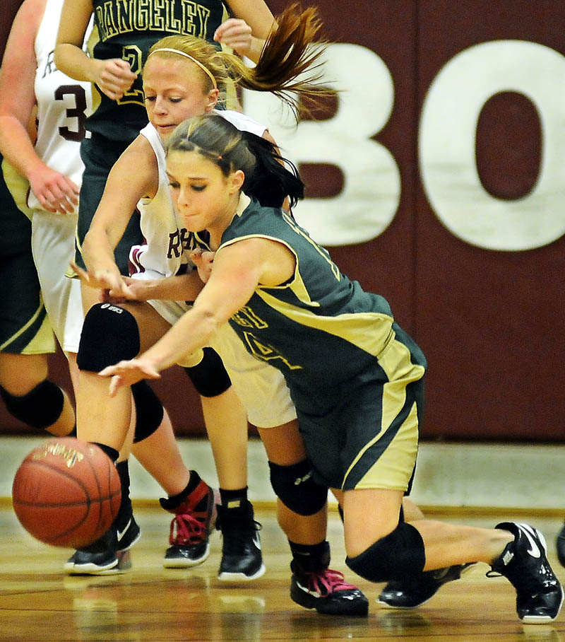 GO GET IT: Richmond High School’s Noell Accord, left, leaps for the ball Tuesday after Rangeley Lakes Regional High School’s Tori Letarte stripped it under the basket during a basketball game in Richmond.
