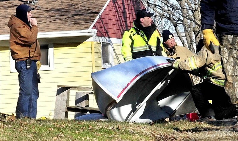 LOOKING EVERYWHERE: Waterville and Winslow fire personnel and game wardens conducted another extensive search of yards and outbuildings at all residences on Violette Avenue in Waterville and surrounding streets for any signs of missing girl Ayla Reynolds.