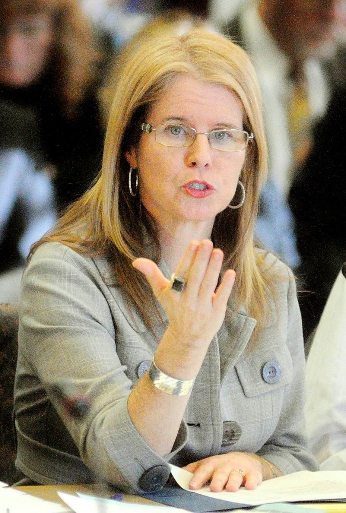 Mary Mayhew, commisoner of the Department of Health and Human Services, answers questions Tuesday in the State House during a meeting about the agency’s budget deficit. A three-day public hearing about Gov. Paul LePage’s planned budget cuts starts today.