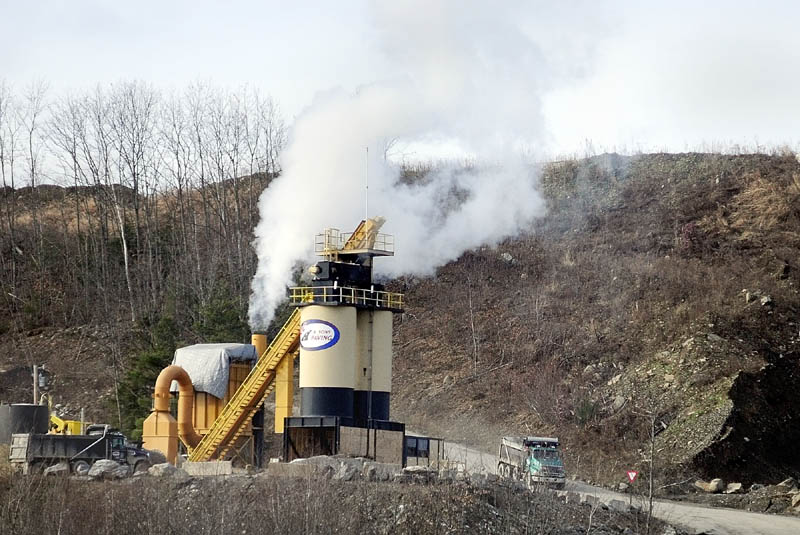 SHUTTING DOWN: A plume of steam rises Friday from the R.C. & Sons Paving plant, located in a pit owned by McGee Construction in Augusta. A plant official Friday said today will likely be the last day the plant operates at its West River Road site and would search during the winter for a more “pro-business” community in central Maine to relocate to soon.