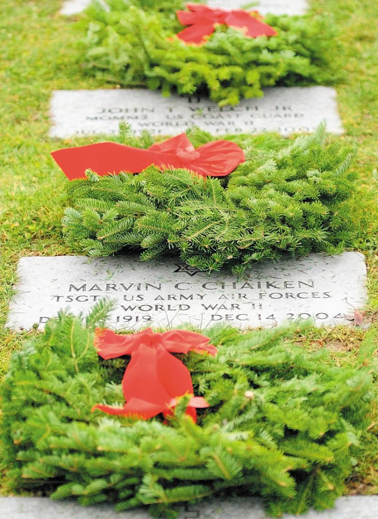 WREATHS ACROSS AMERICA: Hundreds of wreaths were laid on markers Saturday morning at the Maine Veterans’ Memorial Cemetery on Mount Vernon Road in Augusta.