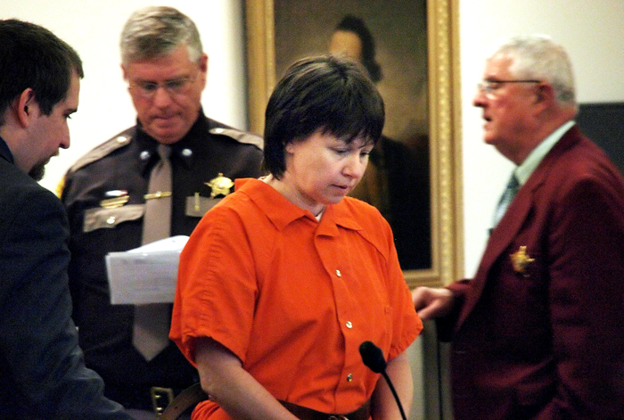 Julianne McCrery, 42, is led into a courtroom in Rockingham County Superior Court in Brentwood, N.H., in this Nov. 4, 2011, photo.